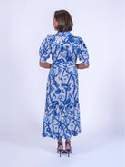 New Day Originals blue botanical print tiered shirt dress back view