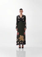 NOIB Aura Nocturnal Jungle green and black printed maxi dress with long sleeves – front model view.