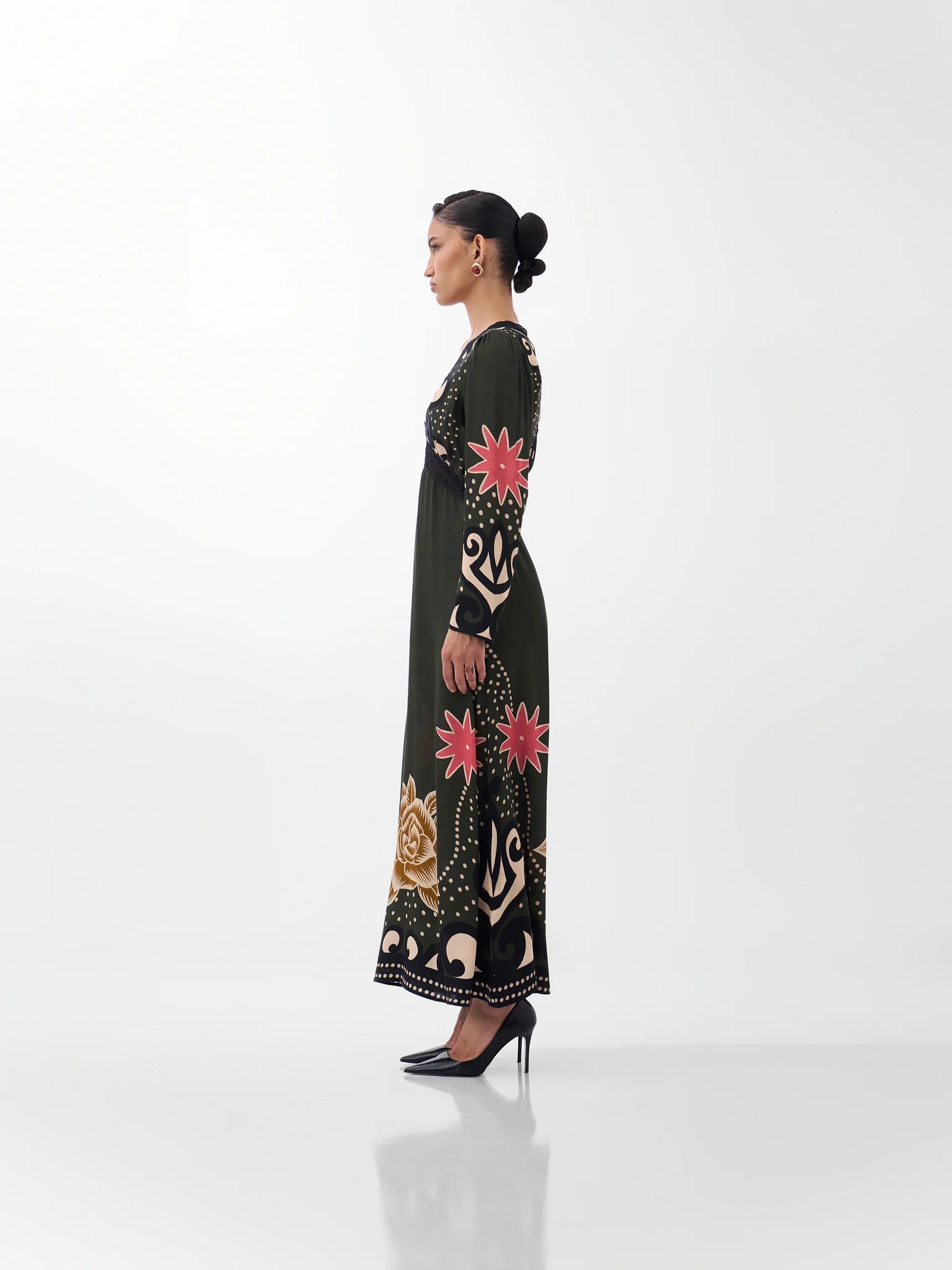 NOIB Aura Old Rose long sleeve printed maxi dress with flowing skirt – side profile view.