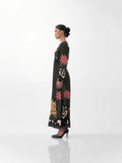 NOIB Aura Old Rose long sleeve printed maxi dress with flowing skirt – side profile view.