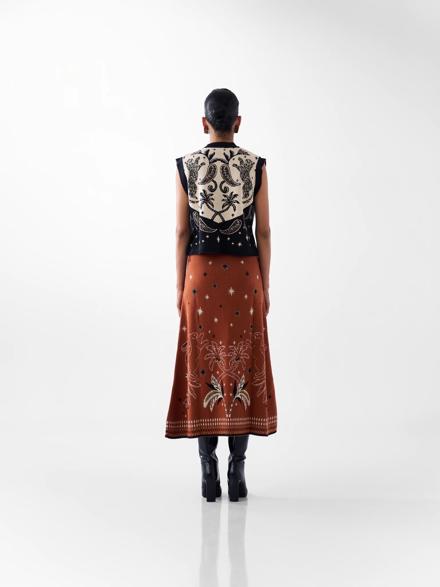 NOIB Lola black and ivory patterned knitted waistcoat with tropical back design – rear outfit view.
