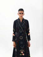 NOIB Willow black printed blazer dress with contrasting lapels and decorative motifs – upper-body model view