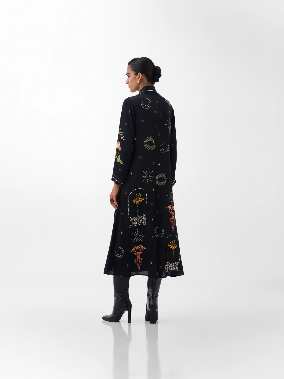 NOIB Willow black printed maxi dress showing decorative motifs across the back – rear model view