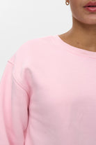 Close-up of neckline and shoulder on Numph cherry blossom sweatshirt