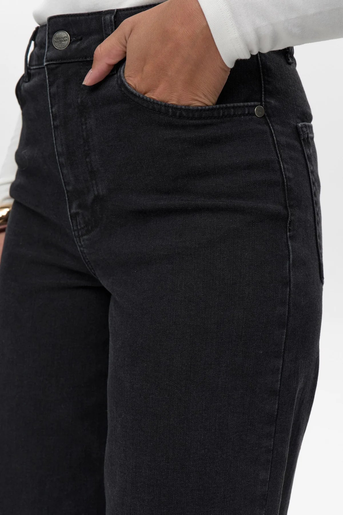 Close-up of front pocket detail on Numph Nuparis black cropped jeans.