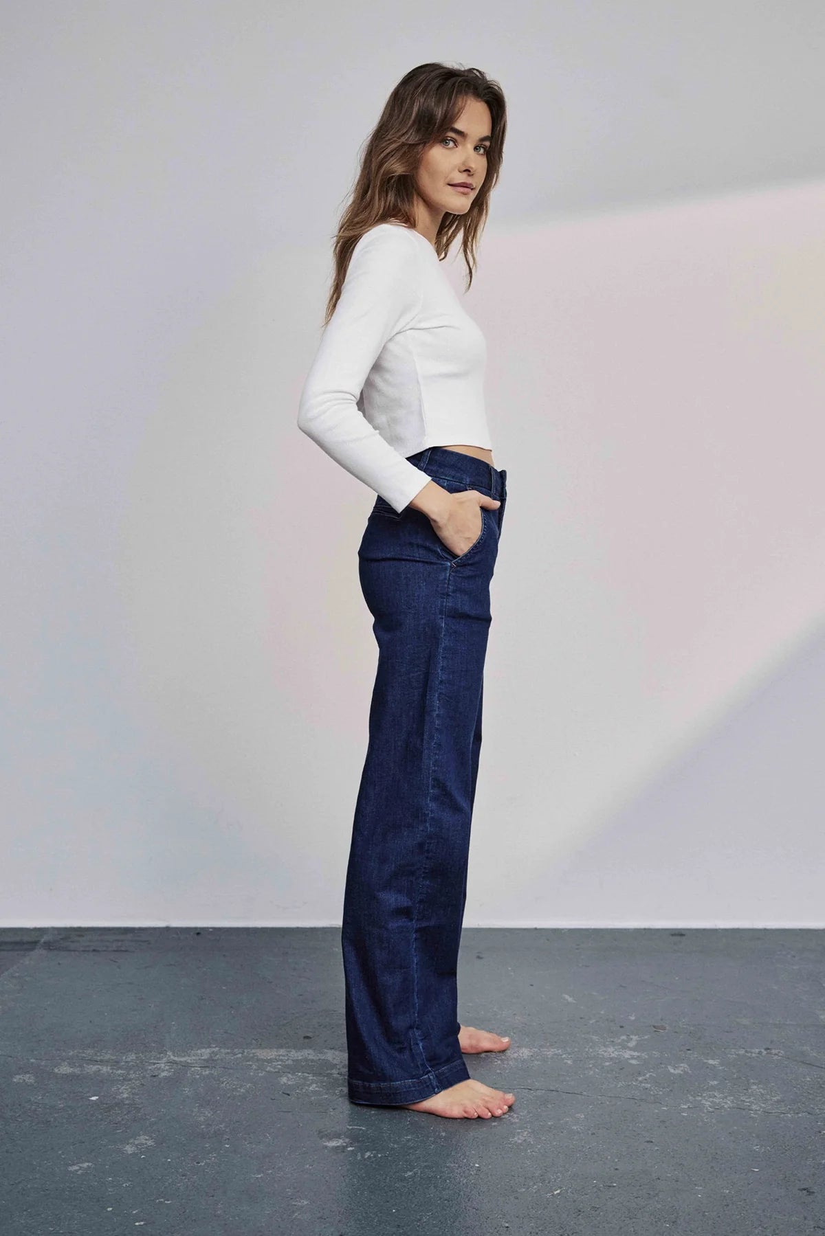 Side profile of Nümph Nuamber high-rise wide-leg denim jeans in dark blue wash.