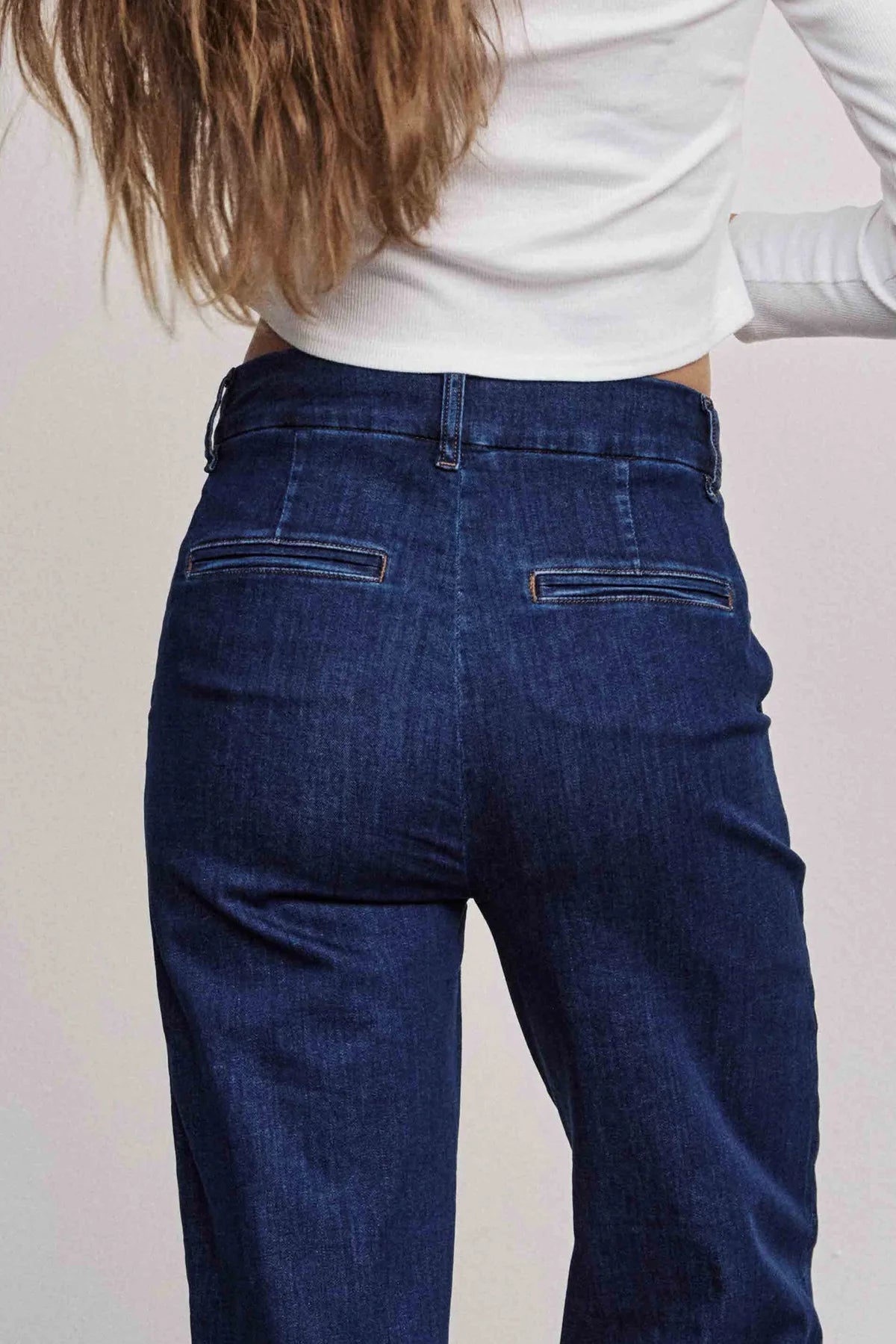 Back view of Nümph Nuamber wide leg women’s  denim jeans in dark blue, high-rise fit with welt pocket detail.
