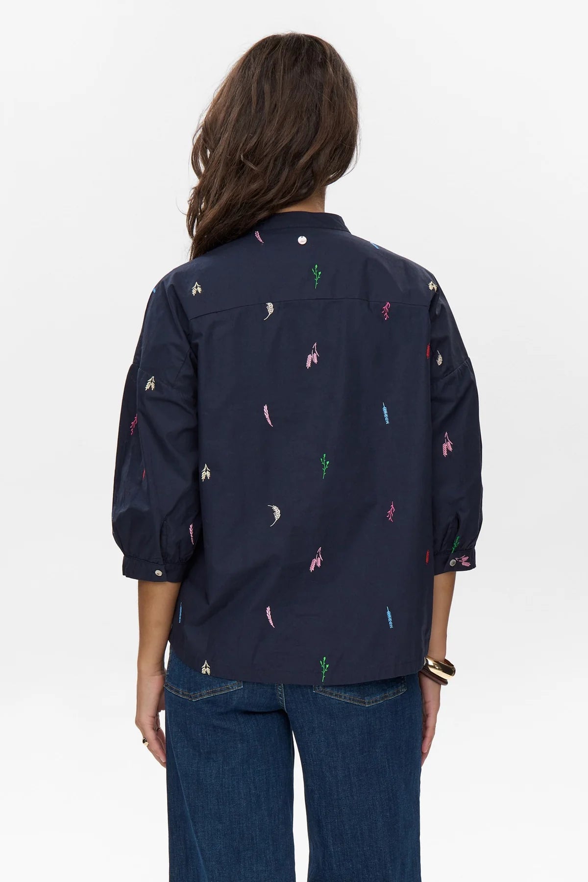 Back view of Numph Nukiva shirt with colourful leaf embroidery In navy