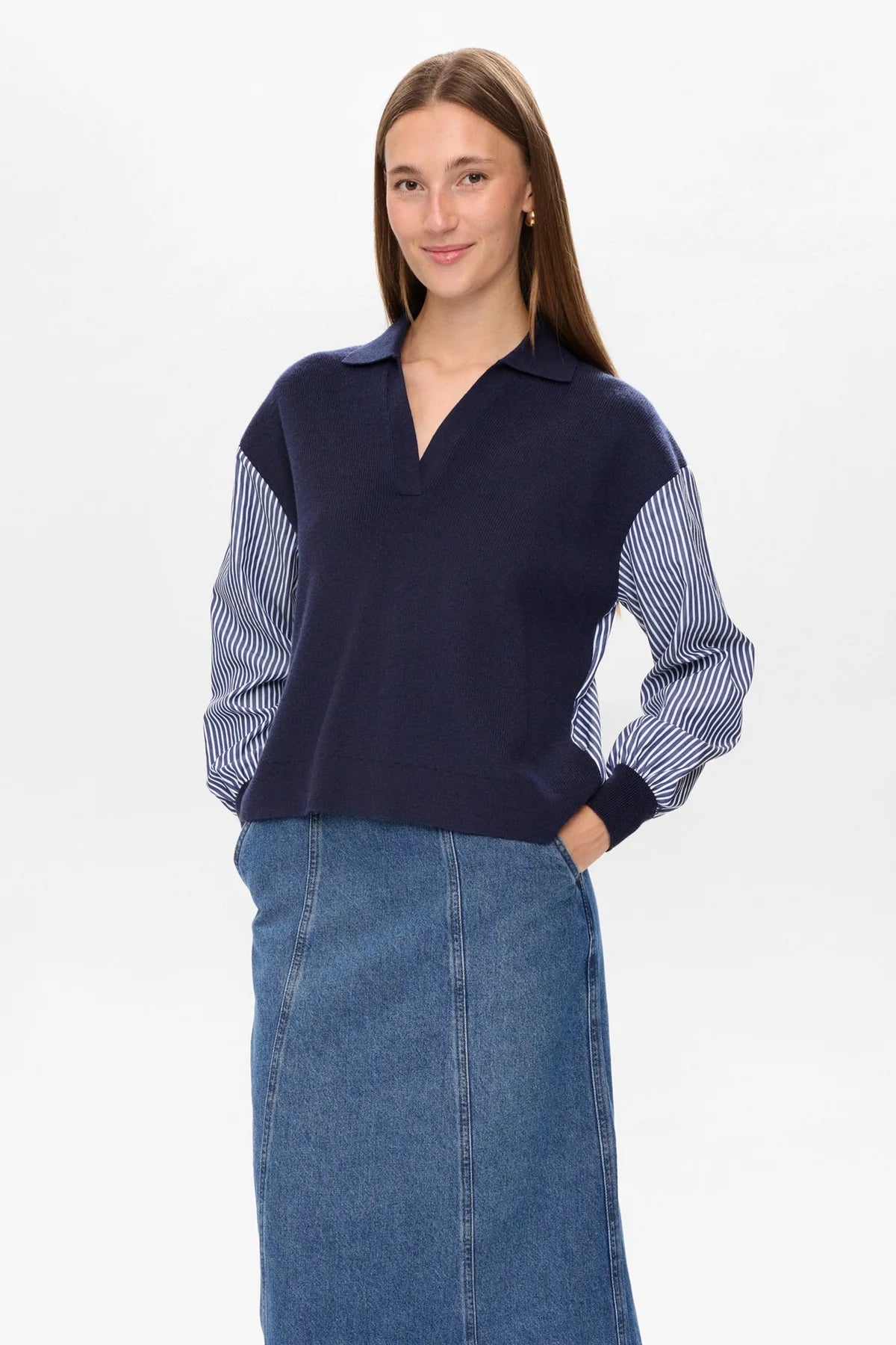 Side view of Numph navy casual knit top with statement striped sleeves