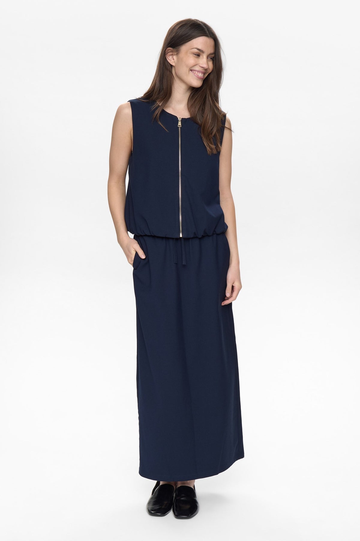 Full length view of Numph Nujulia sleeveless navy vest With matching navy skirt