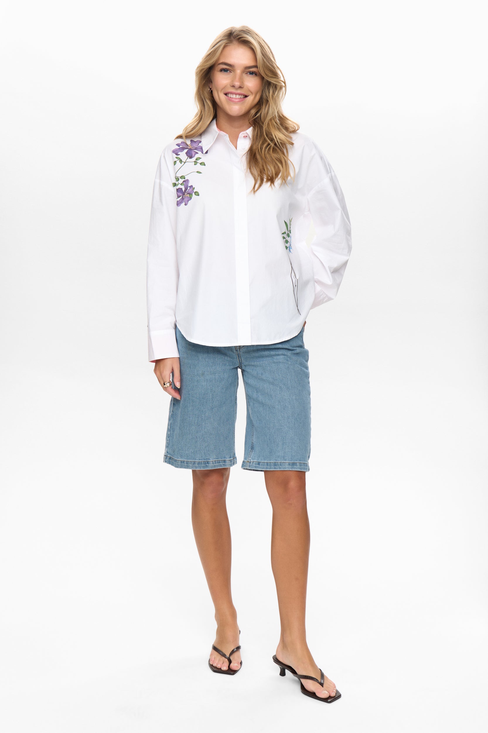 Numph Nuflory white embroidered women’s shirt styled with denim