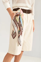 Numph printed scarf styled around a belt 