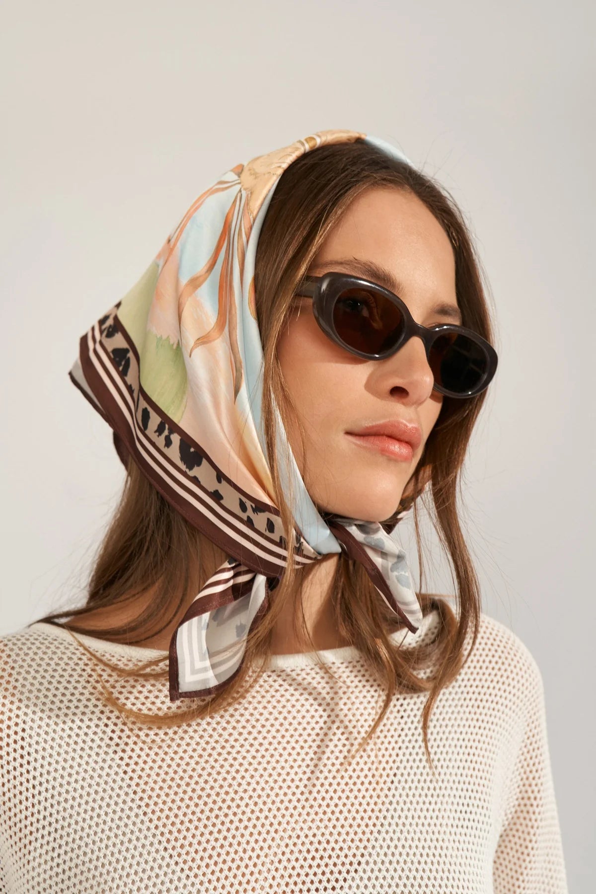 Numph women’s satin scarf tied as headscarf