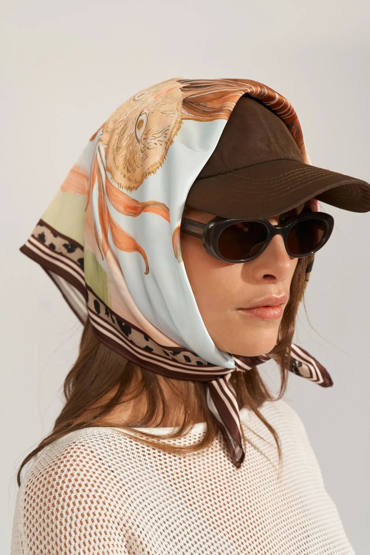 Numph fairytale print scarf tied around hat 