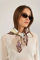 Numph printed scarf styled around neck