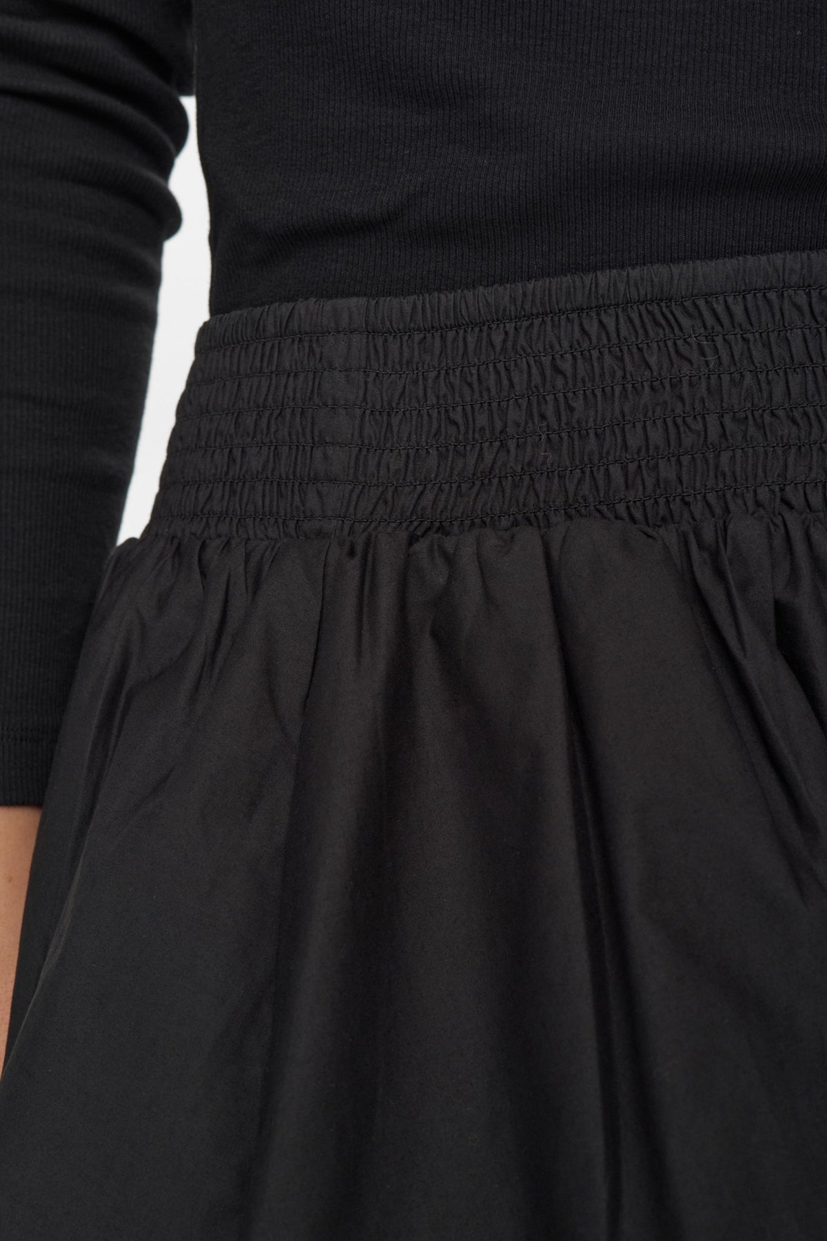 Detail view of smocked waistband on Numph Nunima skirt