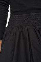 Detail view of smocked waistband on Numph Nunima skirt