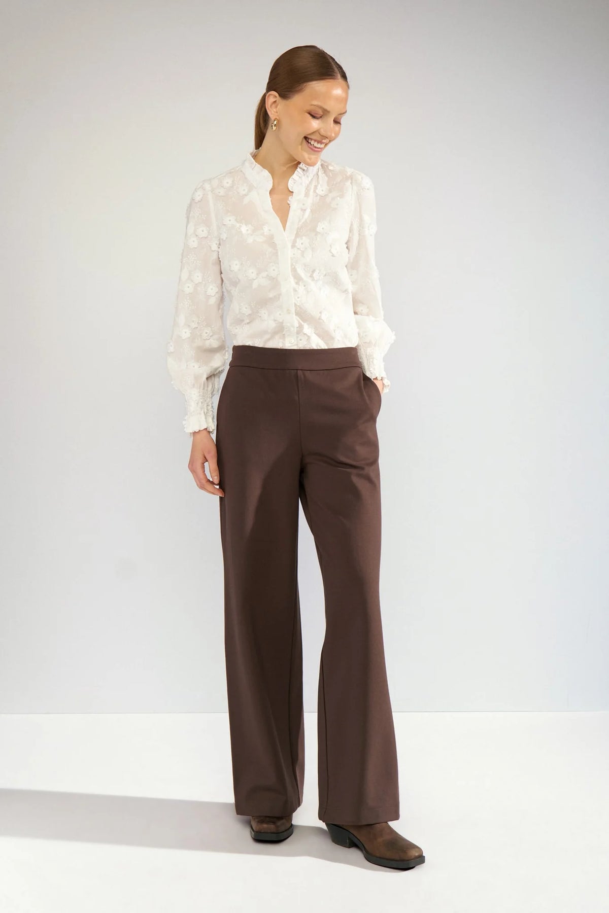 Nümph Nulenea white embroidered blouse styled with brown tailored trousers – full outfit view