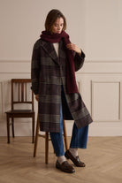 Oui bright blue barrel leg jeans styled with checked coat – lifestyle view