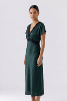 Oui green satin lace trim dress with flutter sleeves – angled model view