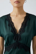 Oui green satin midi dress with black lace V-neck trim – neckline close-up