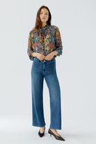 Oui bright blue straight leg jeans styled with floral blouse – full model view