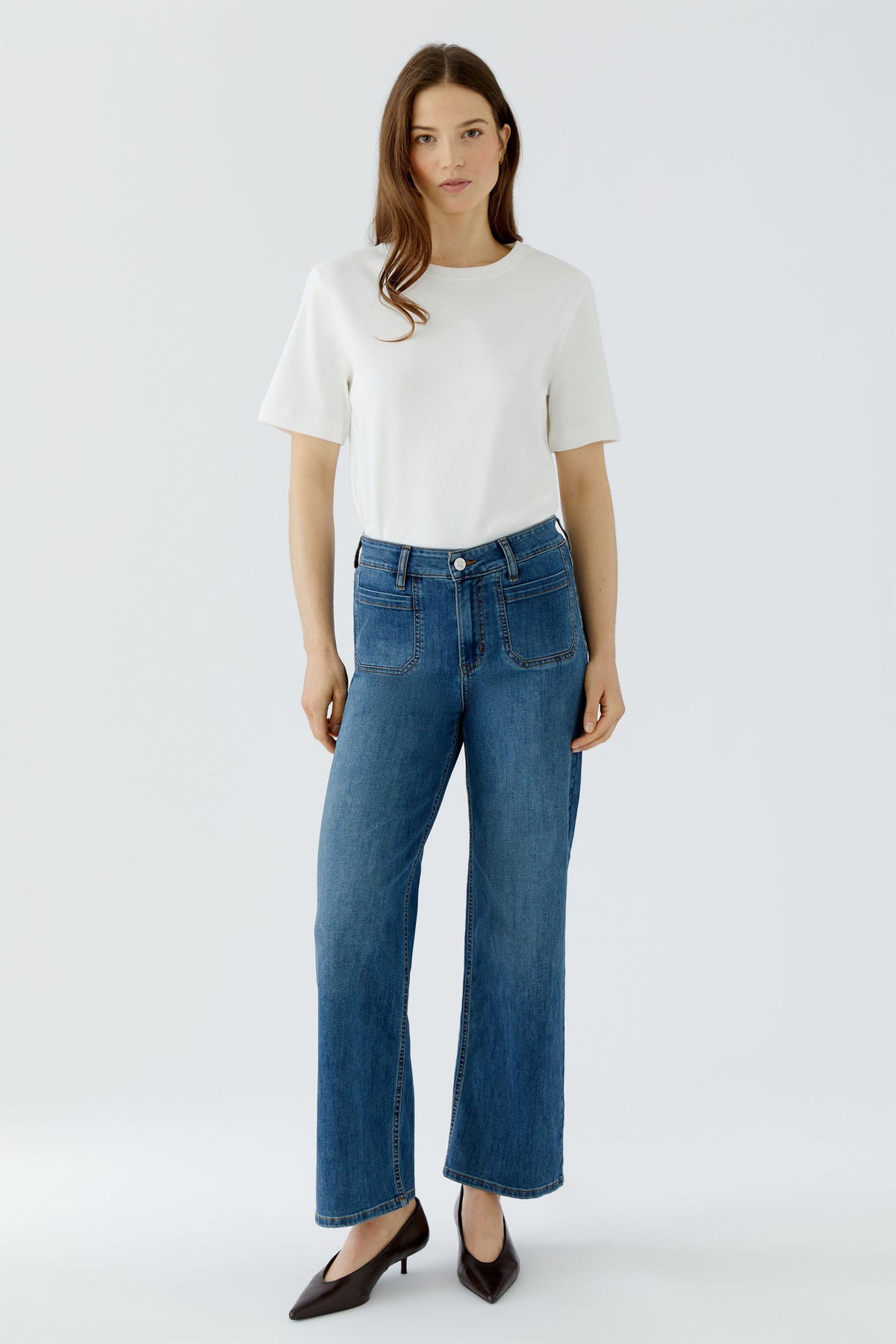 Oui blue straight leg patch pocket jeans styled with white top – front model view