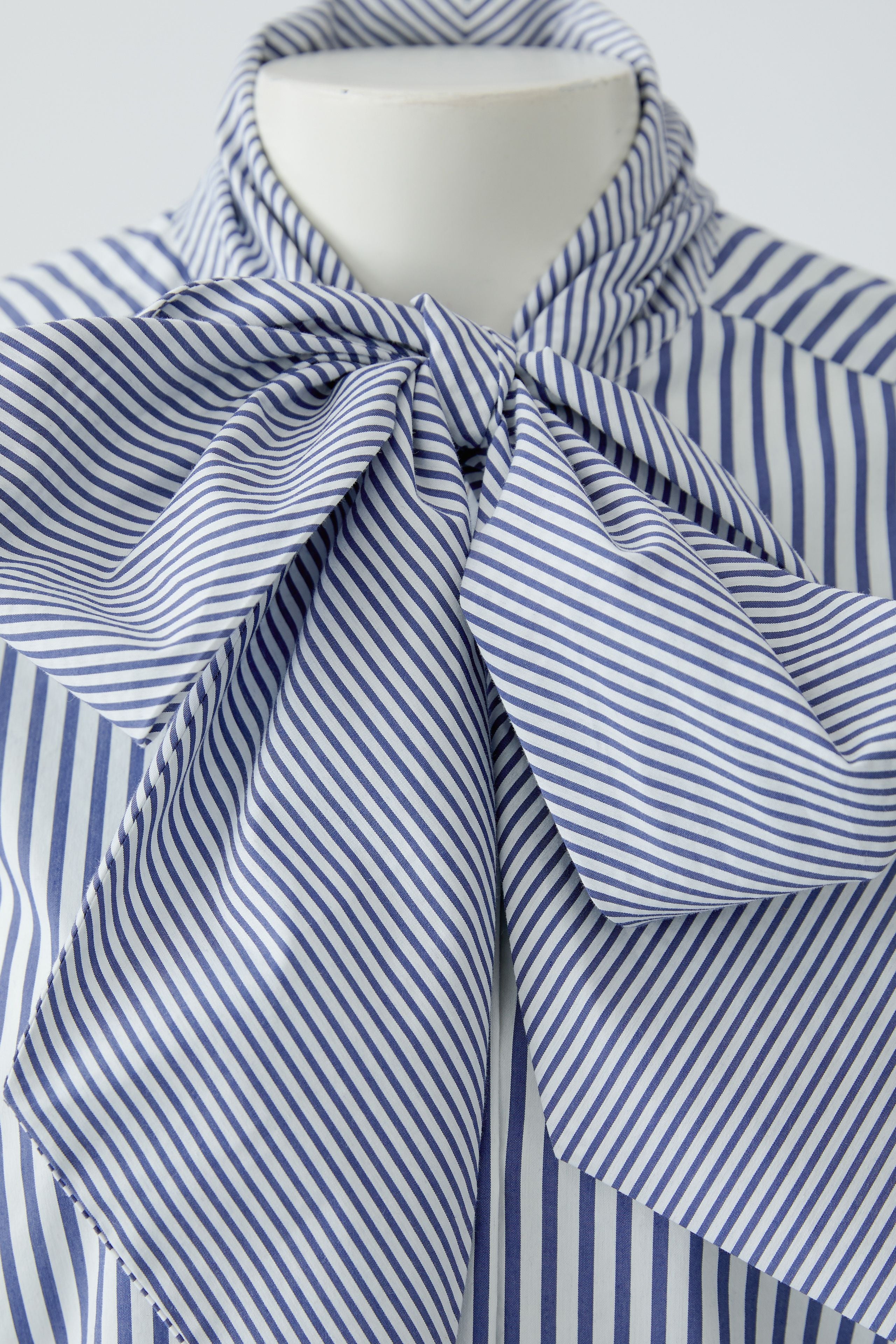 Oui blue and white striped blouse with oversized bow neckline – detail view