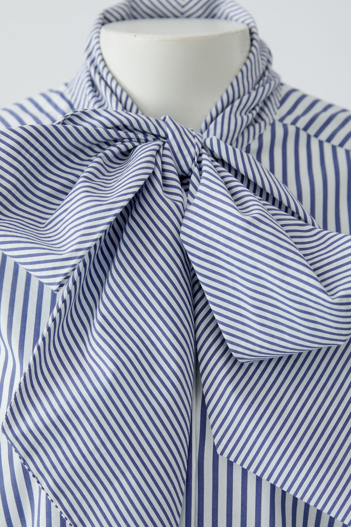 Oui blue and white striped blouse with oversized bow neckline – detail view