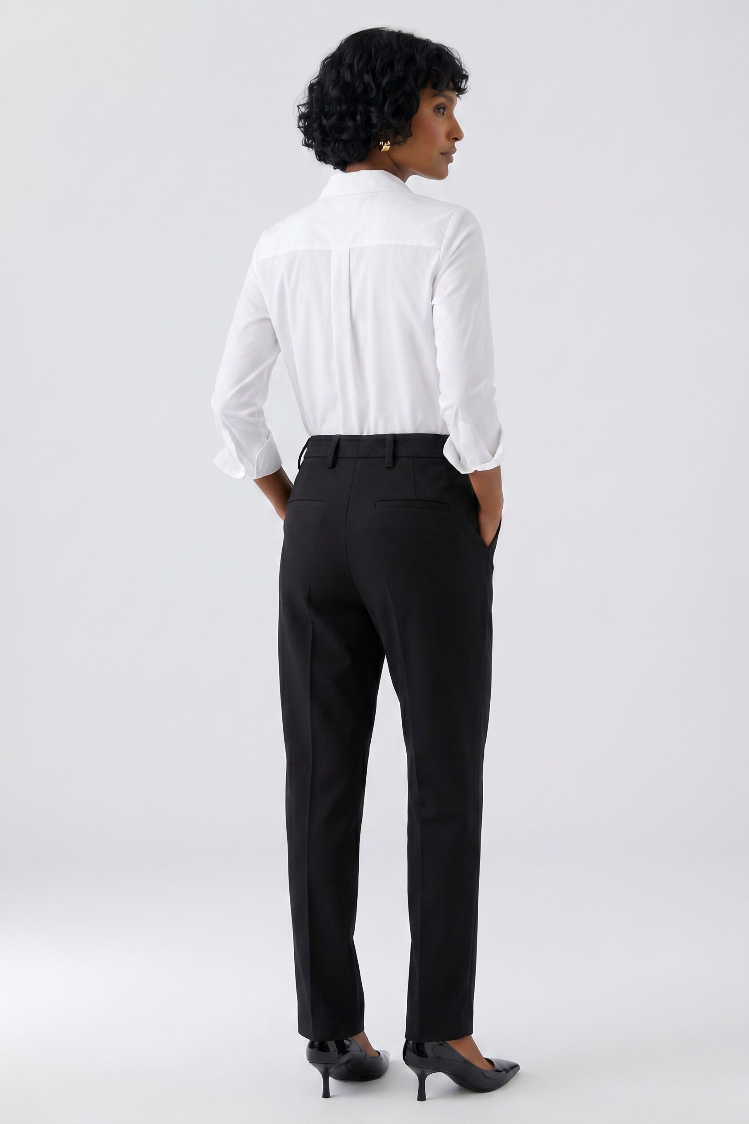 Oui black stretch crepe tailored trousers with slim leg – back model view