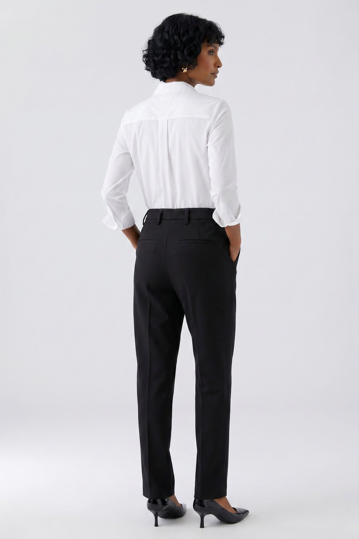 Oui black stretch crepe tailored trousers with slim leg – back model view