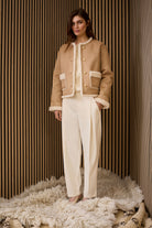 Oui ecru bouclé jumper with drawstring hem Paired with winter tan and cream shearling jacket 
