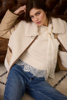 Oui reversible jacket — lifestyle image, ecru side styled with denim.