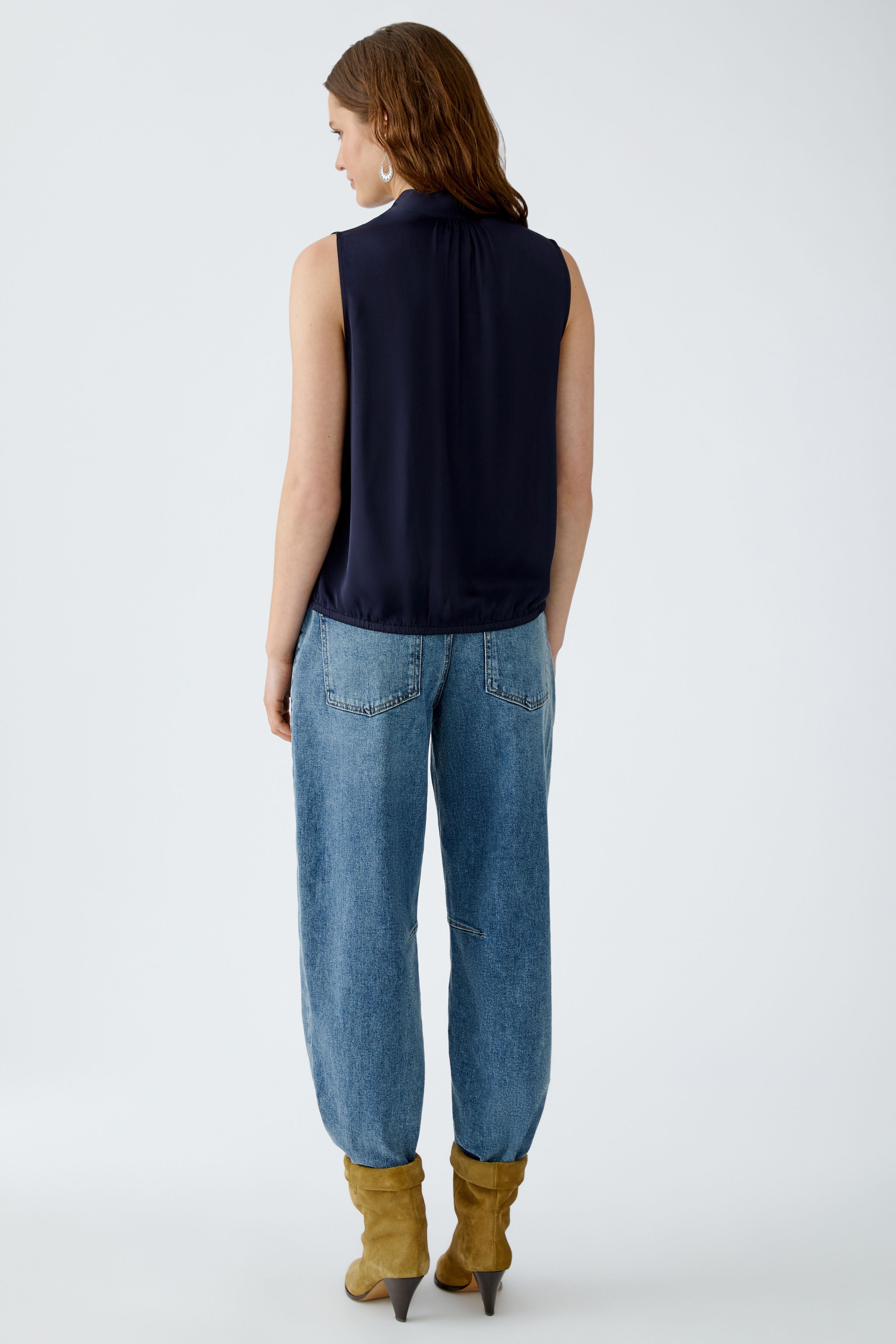 Back view of Oui navy satin blouse showing sleeveless cut and relaxed hem