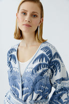 Model wearing Oui belted fringed cardigan in soft knit