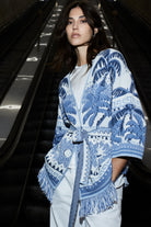 Fringed summer knit cardigan styled with white trousers