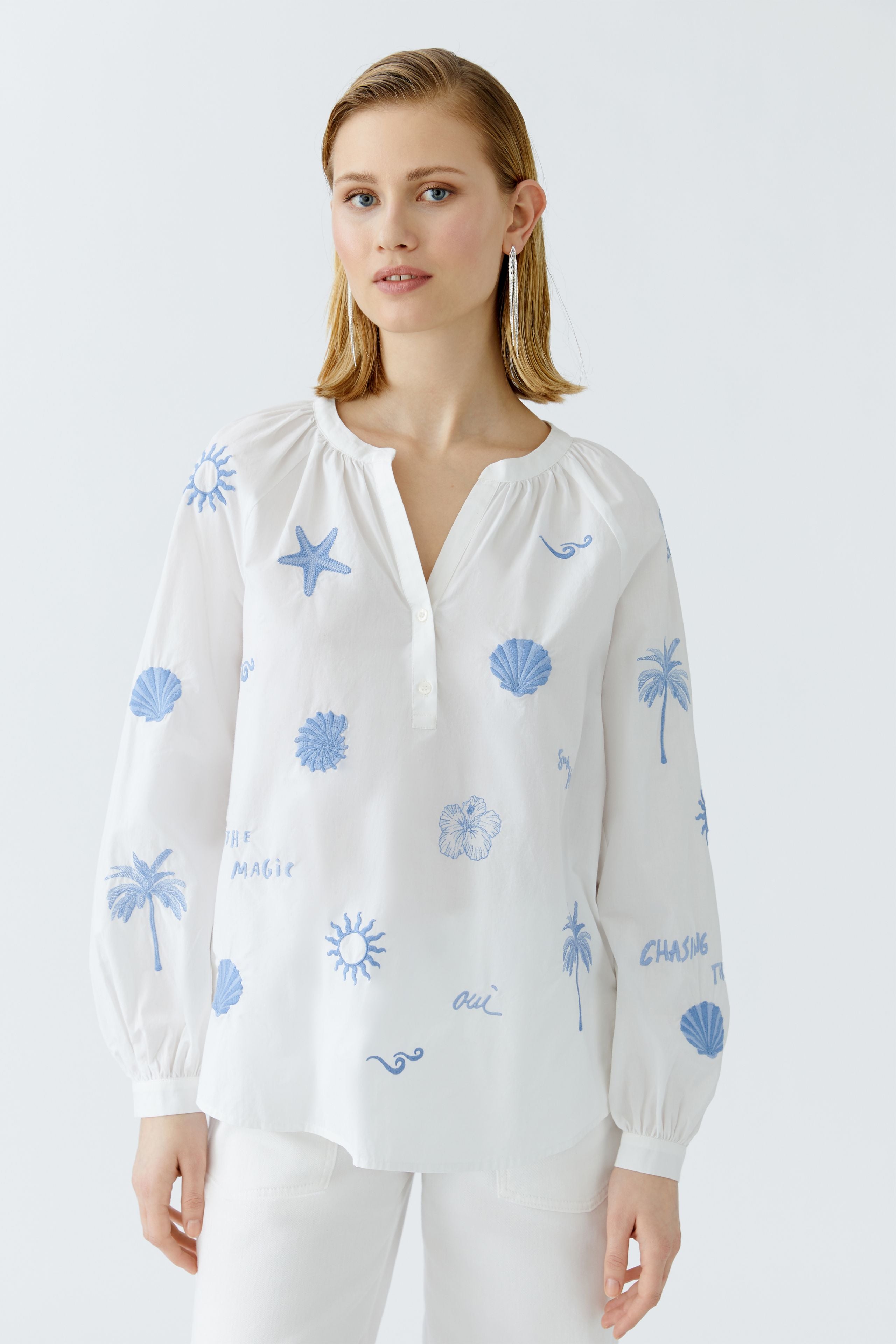 Model wearing embroidered summer tunic by Oui