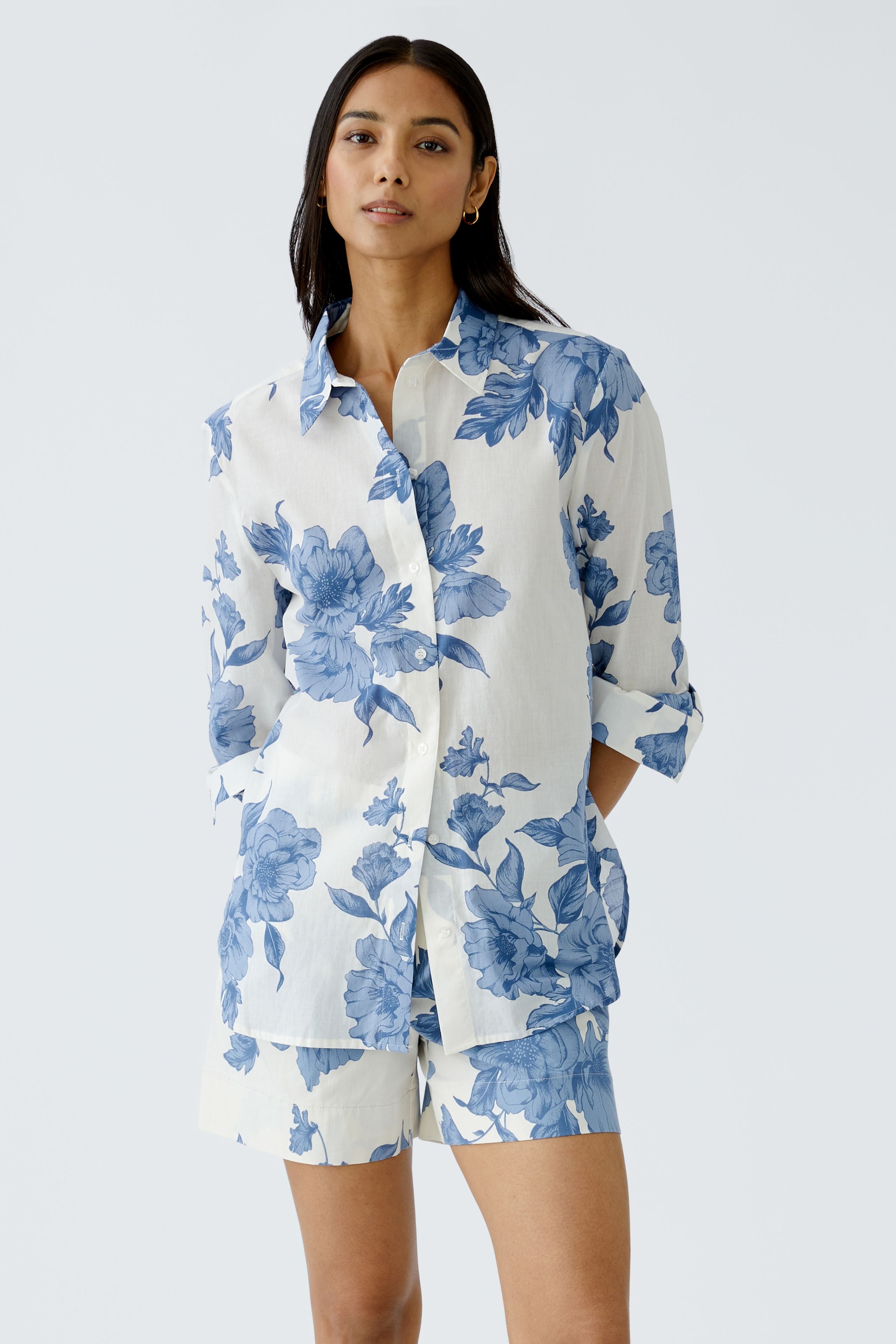 Model wearing Oui cotton blend wide-leg floral shorts