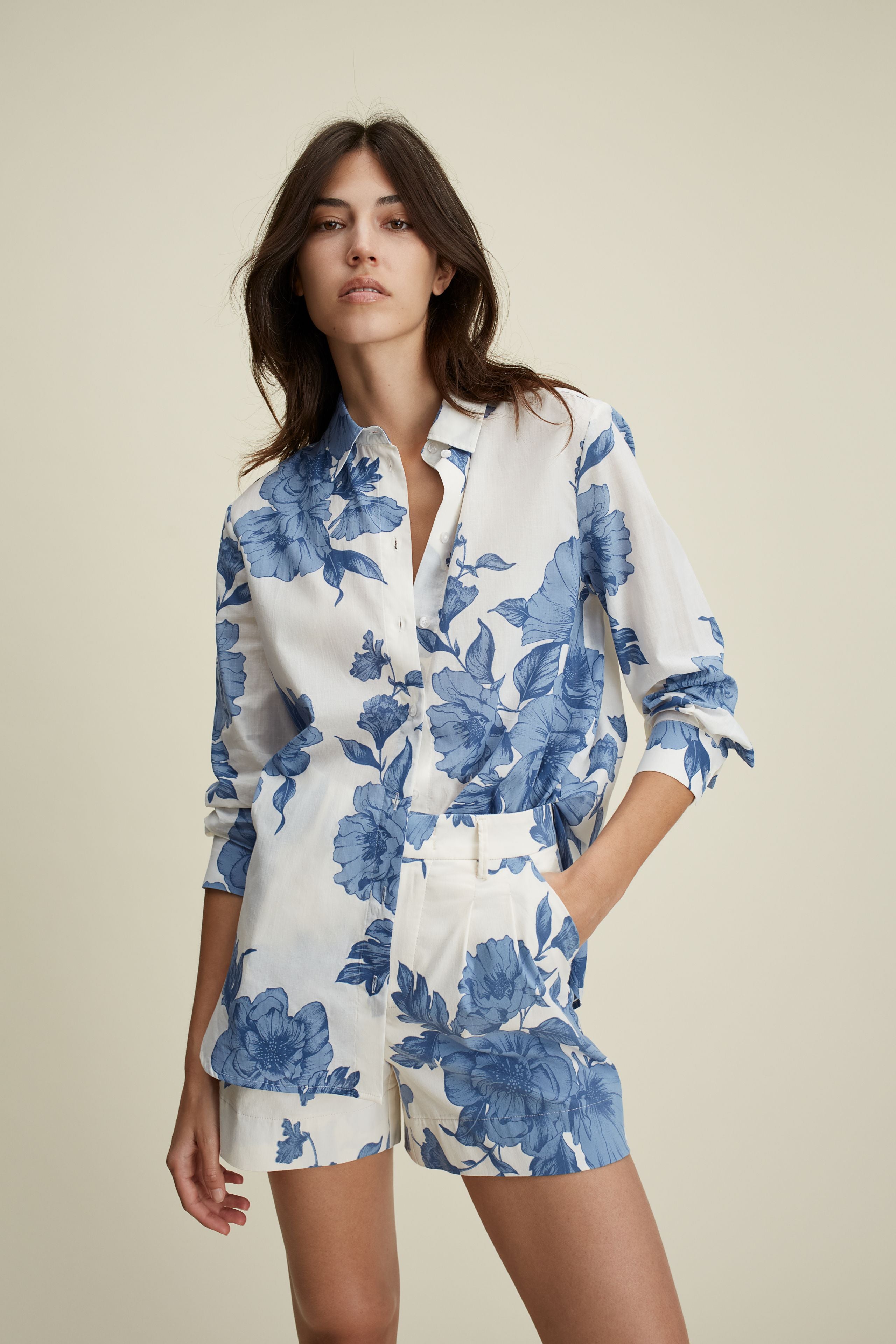 Oui cotton blend floral shorts styled with blue tank top