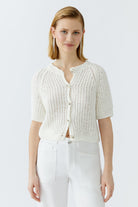 Front view of cropped short-sleeve knit cardigan in light ivory