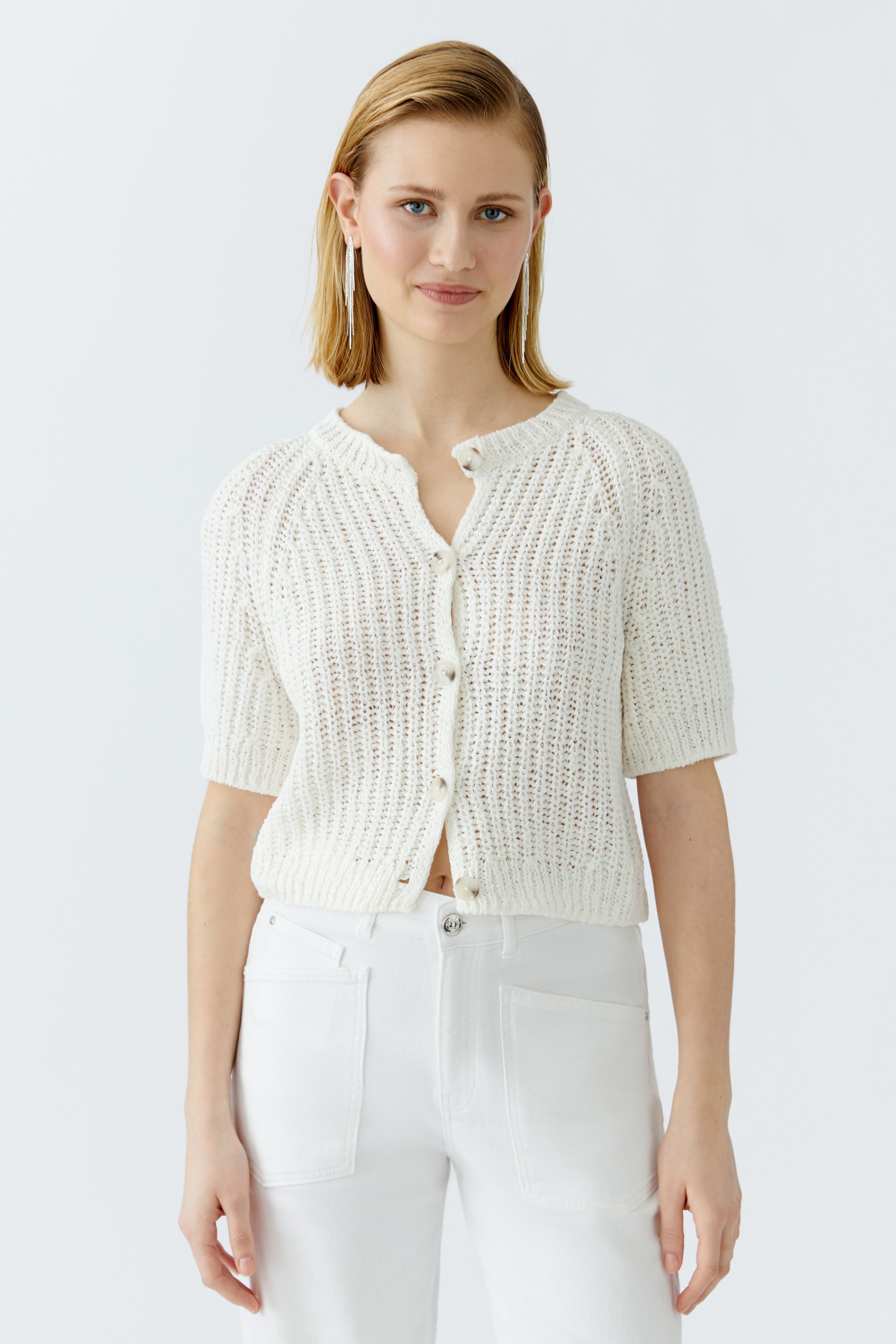 Front view of cropped short-sleeve knit cardigan in light ivory