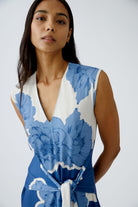Model wearing sleeveless floral print jumpsuit by Oui – front view