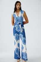 Model wearing sleeveless floral print jumpsuit by Oui