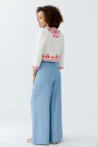 Oui bolero jacket with pink scalloped edging and floral detail from back 