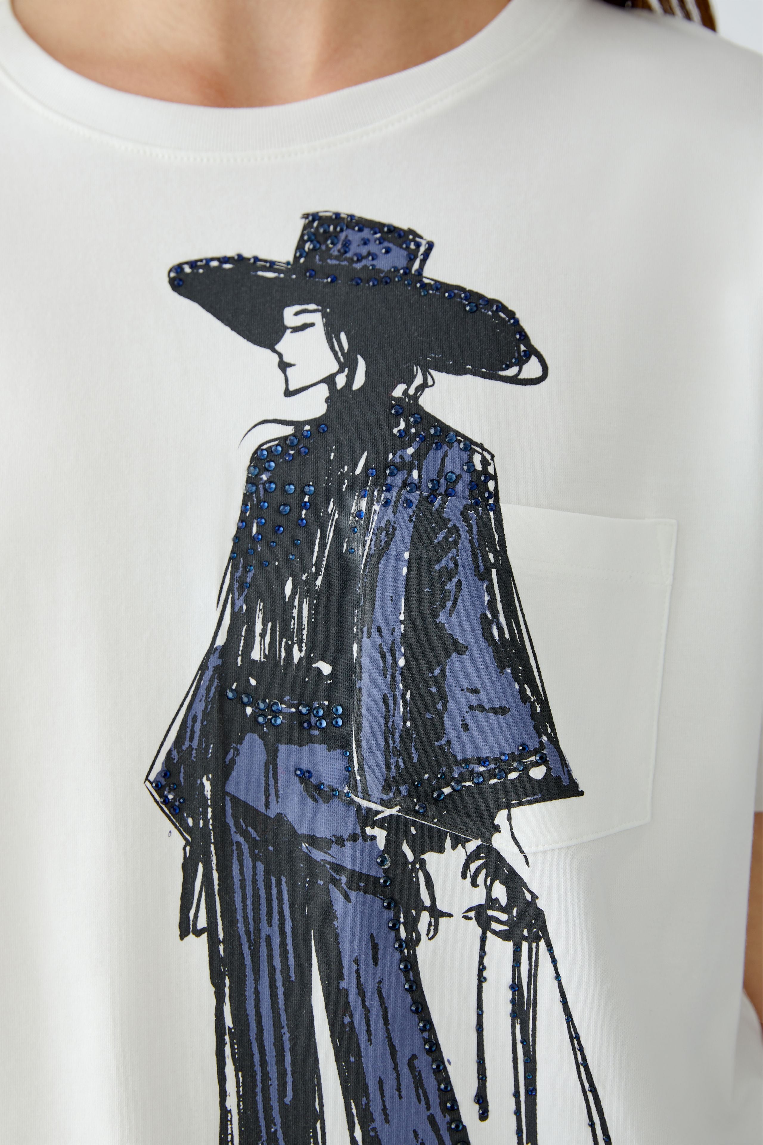 Close-up of navy rodeo-inspired illustration with tonal stones on Oui t-shirt