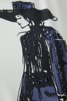 Detailed view of graphic and overprinted chest pocket on white Oui t-shirt
