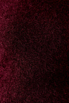 Close-up of cosy fluffy berry jumper from Oui 