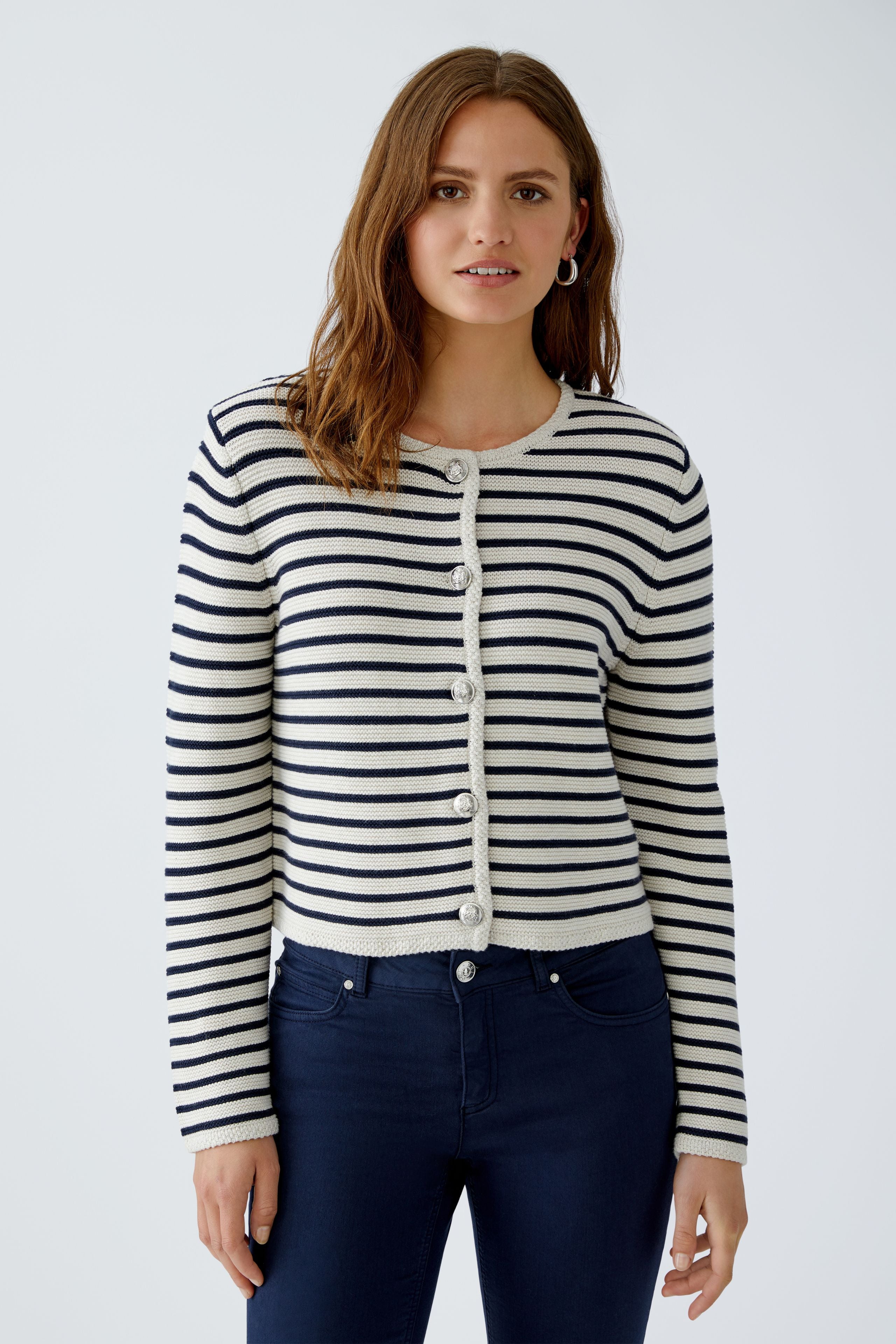 Front close-up of stripe detail and emblem buttons on Oui cotton cardigan