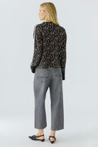 Oui sporty knitted letter print jumper back view on model, showing clean jacquard knit and plain black cuffs