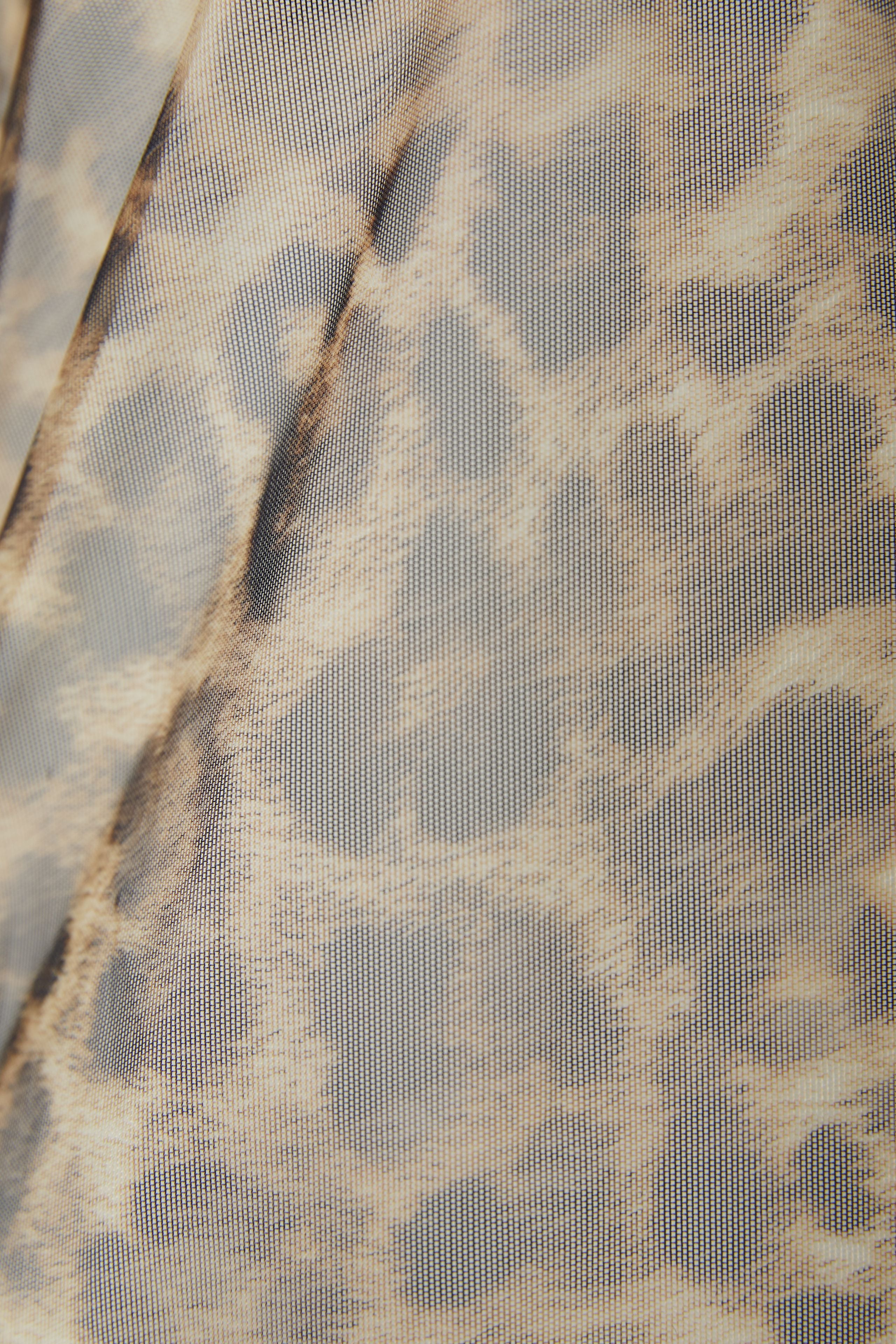 Oui tan leopard mesh top – flat lay of top with ruffle trim